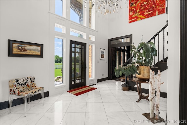 3511 E 181st St S, Bixby, OK 74008 - entrance foyer featuring stairway, a towering ceiling, and baseboards