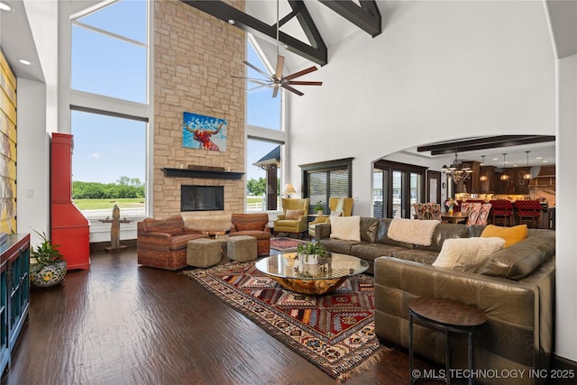 3511 E 181st St S, Bixby, OK 74008 - living area featuring high vaulted ceiling, a fireplace, wood finished floors, a chandelier, and beamed ceiling