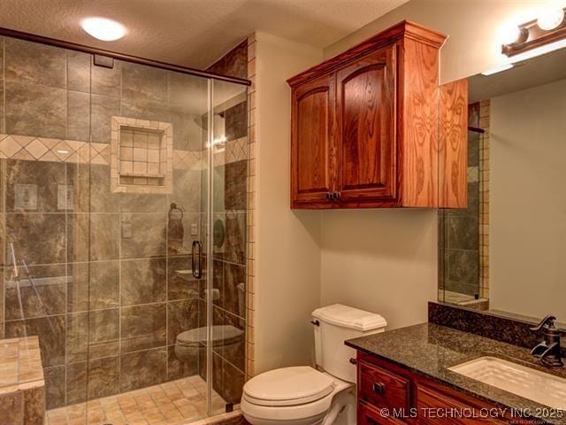 3511 E 181st St S, Bixby, OK 74008 - bathroom with toilet, vanity, and a stall shower