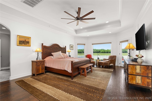 3511 E 181st St S, Bixby, OK 74008 - bedroom with arched walkways, recessed lighting, a tray ceiling, dark wood-type flooring, and access to exterior
