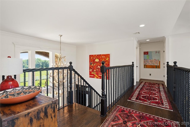 3511 E 181st St S, Bixby, OK 74008 - hall featuring an upstairs landing, wood finished floors, a chandelier, crown molding, and baseboards