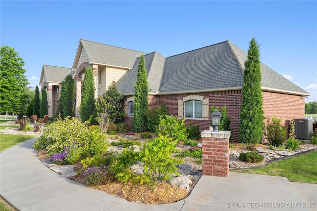 3511 E 181st St S, Bixby, OK 74008 - view of home's exterior with brick siding, central air condition unit, and a shingled roof