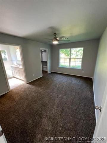 130 W Lincoln Ave, Sapulpa, OK 74066 - unfurnished room with a ceiling fan, dark carpet, and baseboards