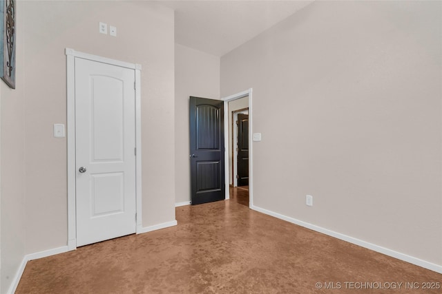 26115 US Highway 70, Bokchito, OK 74726 - unfurnished bedroom featuring finished concrete flooring and baseboards