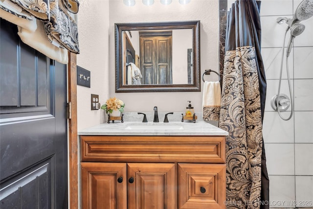 26115 US Highway 70, Bokchito, OK 74726 - bathroom featuring vanity, a shower, and a textured wall