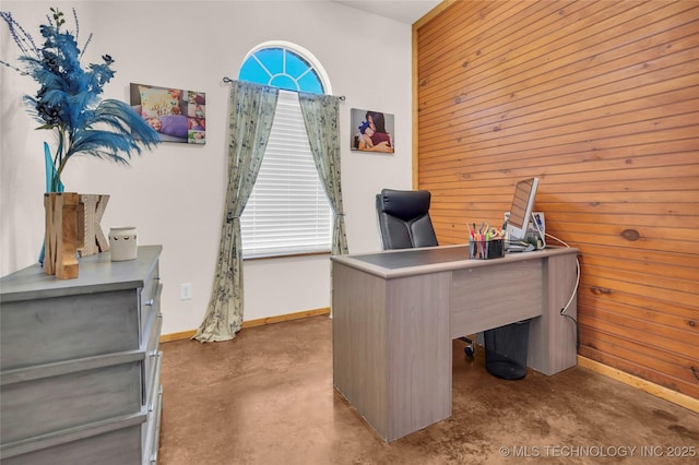 26115 US Highway 70, Bokchito, OK 74726 - home office featuring finished concrete flooring, wood walls, and baseboards