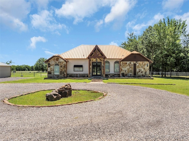 26115 US Highway 70, Bokchito, OK 74726 - view of front of house featuring stone siding, french doors, and curved driveway