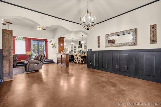 26115 US Highway 70, Bokchito, OK 74726 - dining area featuring a chandelier, concrete flooring, a ceiling fan, and arched walkways