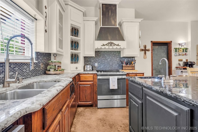 26115 US Highway 70, Bokchito, OK 74726 - kitchen with stainless steel stove, a sink, white cabinets, and custom range hood