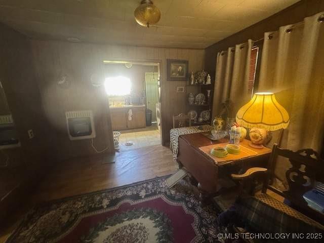 223 W Delaware St, Jay, OK 74346 - living area with wood finished floors and heating unit
