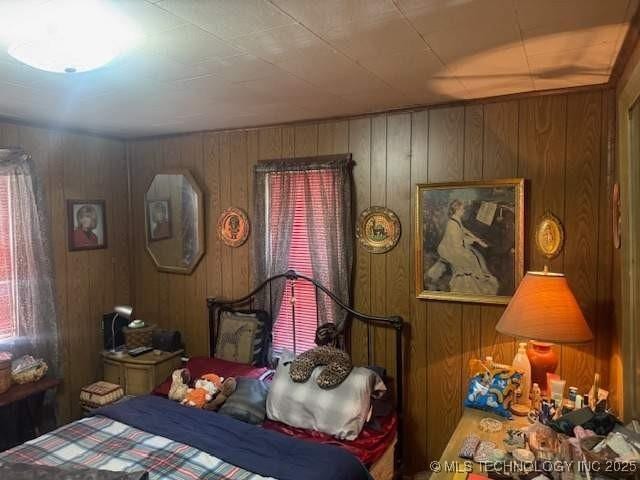 223 W Delaware St, Jay, OK 74346 - bedroom with wood walls