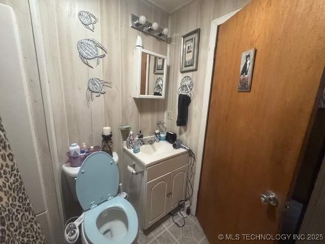 223 W Delaware St, Jay, OK 74346 - bathroom with toilet and vanity