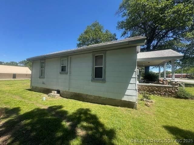 223 W Delaware St, Jay, OK 74346 - view of home's exterior featuring a yard