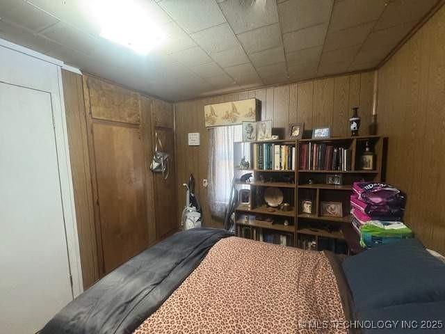 223 W Delaware St, Jay, OK 74346 - bedroom with wooden walls