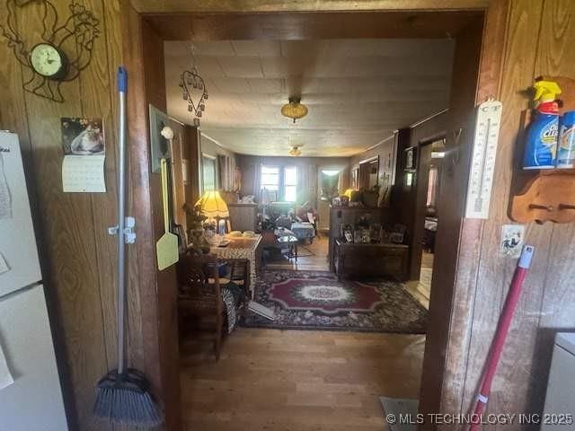 223 W Delaware St, Jay, OK 74346 - hall featuring wood finished floors and wood walls