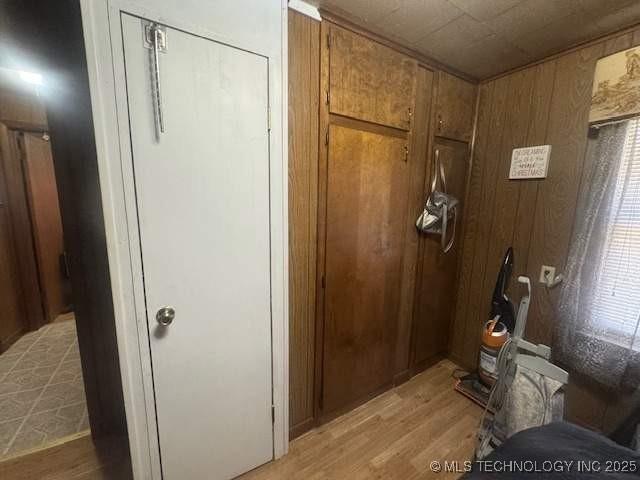 223 W Delaware St, Jay, OK 74346 - interior space with wood finished floors and wooden walls