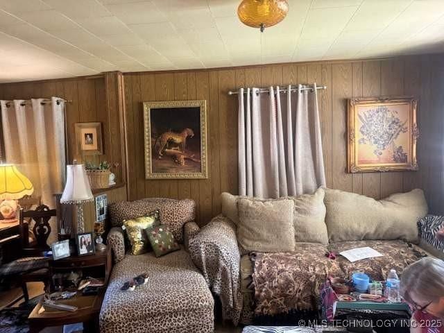 223 W Delaware St, Jay, OK 74346 - living area with wooden walls