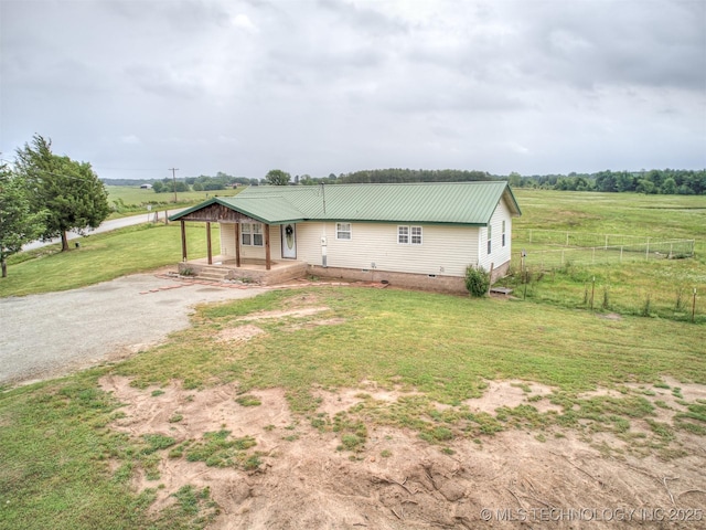 32550 S 250th Rd, Henryetta, OK 74437 - view of front facade featuring metal roof, covered porch, gravel driveway, a view of countryside, and crawl space