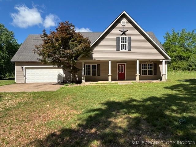 21253 S 530th Rd, Tahlequah, OK 74464 - view of front facade featuring concrete driveway, covered porch, a front yard, and a garage
