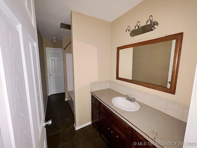 21253 S 530th Rd, Tahlequah, OK 74464 - bathroom featuring vanity, decorative backsplash, and tile patterned flooring