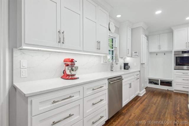 201 E 24th Pl, Tulsa, OK 74114 - kitchen featuring stainless steel appliances, a sink, backsplash, white cabinetry, and recessed lighting