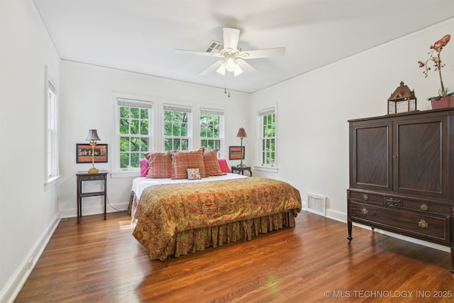 201 E 24th Pl, Tulsa, OK 74114 - bedroom featuring dark wood-type flooring, baseboards, and a ceiling fan