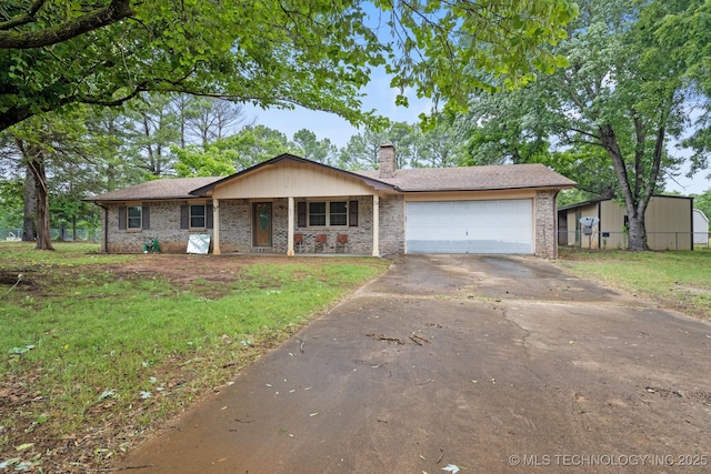 83 Oak St, Durant, OK 74701 - ranch-style house with driveway, a chimney, an attached garage, a front yard, and a porch