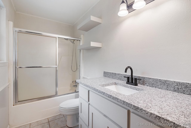 83 Oak St, Durant, OK 74701 - bathroom featuring vanity, toilet, shower / bath combination with glass door, tile patterned flooring, and crown molding