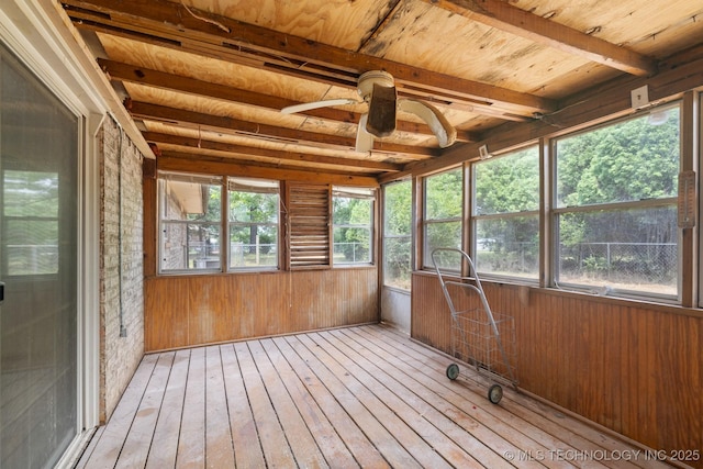 83 Oak St, Durant, OK 74701 - unfurnished sunroom with wood-type flooring, ceiling fan, wooden walls, and wooden ceiling with exposed beams