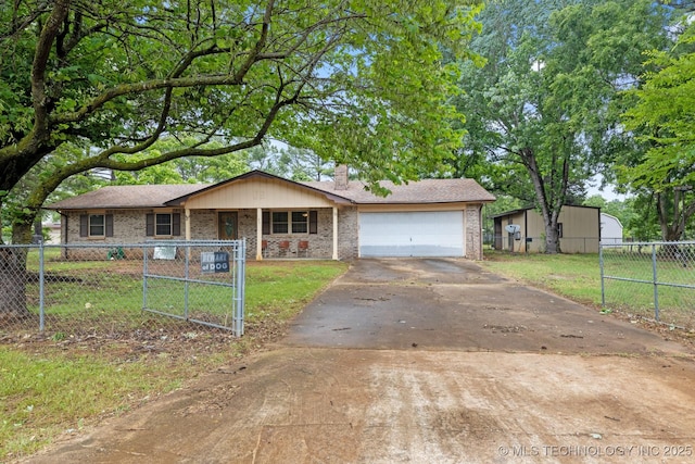 83 Oak St, Durant, OK 74701 - view of front facade featuring asphalt driveway, brick siding, a chimney, an attached garage, and covered porch