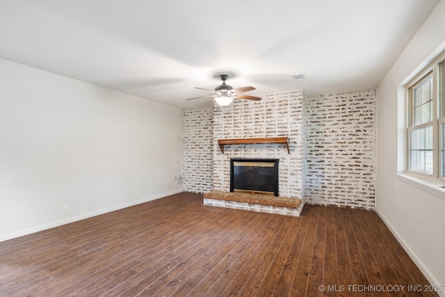 83 Oak St, Durant, OK 74701 - unfurnished living room featuring a ceiling fan, wood finished floors, a fireplace, and baseboards