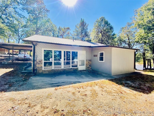 116942 S 4244th Rd, Eufaula, OK 74432 - rear view of property featuring stone siding and metal roof