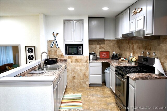 116942 S 4244th Rd, Eufaula, OK 74432 - kitchen featuring stainless steel gas stove, a sink, a peninsula, black microwave, and under cabinet range hood