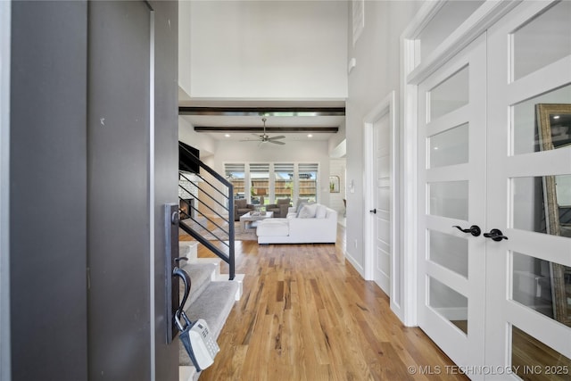 1205 W 88th St S, Tulsa, OK 74132 - foyer entrance featuring a ceiling fan, stairway, and light wood-style flooring