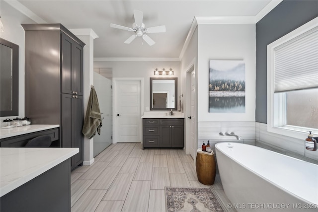 1205 W 88th St S, Tulsa, OK 74132 - full bathroom featuring a freestanding bath, ceiling fan, ornamental molding, vanity, and a shower