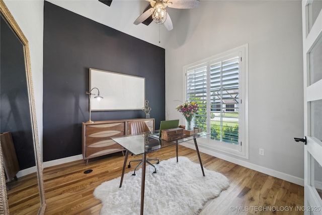 1205 W 88th St S, Tulsa, OK 74132 - office space featuring ceiling fan, baseboards, wood finished floors, and a high ceiling