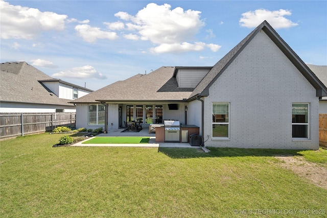 1205 W 88th St S, Tulsa, OK 74132 - rear view of property with brick siding, a patio, and roof with shingles