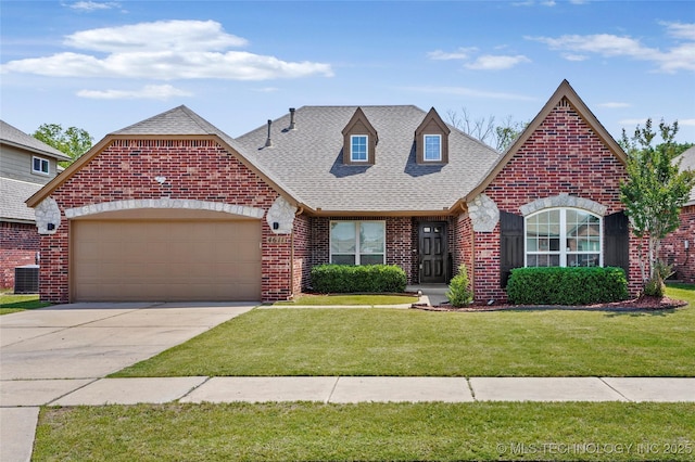 4611 N 36th Pl, Broken Arrow, OK 74014 - view of front of house featuring brick siding, roof with shingles, central air condition unit, an attached garage, and a front yard
