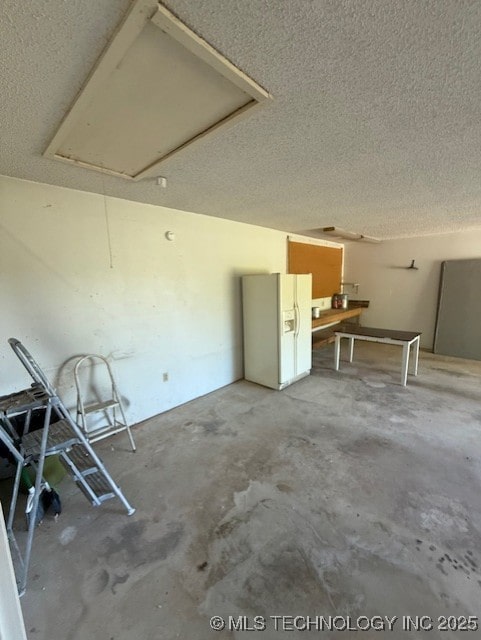 3229 E Cherokee Ave, Sallisaw, OK 74955 - garage with white fridge with ice dispenser