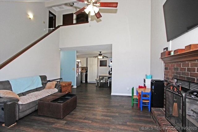 1146 E 137th St, Glenpool, OK 74033 - living room with a ceiling fan, a brick fireplace, high vaulted ceiling, wood finished floors, and baseboards