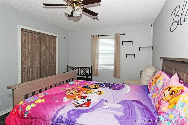 1146 E 137th St, Glenpool, OK 74033 - bedroom featuring a textured ceiling and a ceiling fan
