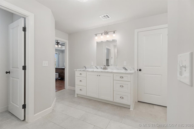 8209 N 150th Ave E, Owasso, OK 74055 - bathroom with vanity, tile patterned flooring, ceiling fan, and baseboards