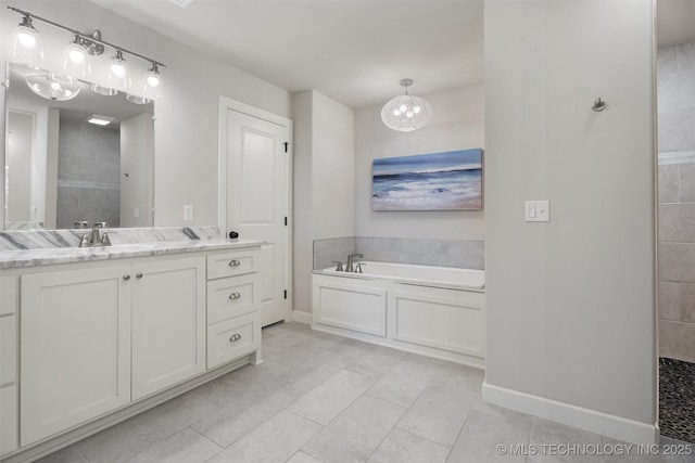 8209 N 150th Ave E, Owasso, OK 74055 - bathroom with baseboards, a garden tub, vanity, tile patterned floors, and tiled shower