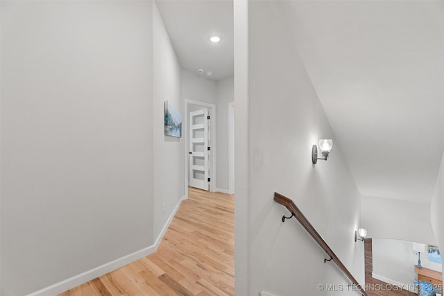 8209 N 150th Ave E, Owasso, OK 74055 - corridor featuring an upstairs landing, wood finished floors, baseboards, and recessed lighting