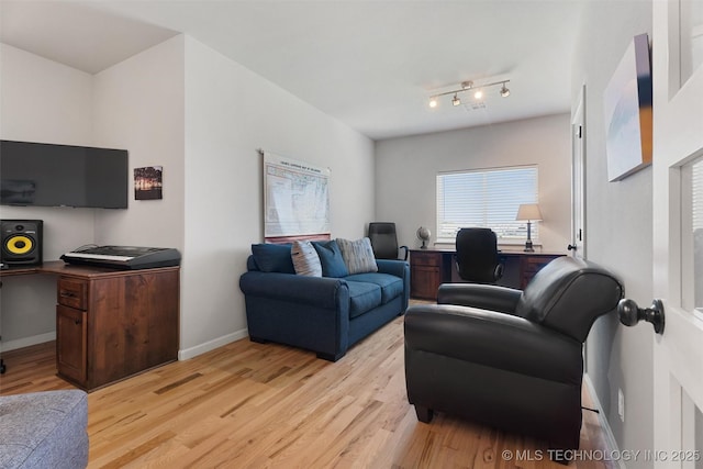 8209 N 150th Ave E, Owasso, OK 74055 - living room featuring an office area, light wood-style flooring, and baseboards
