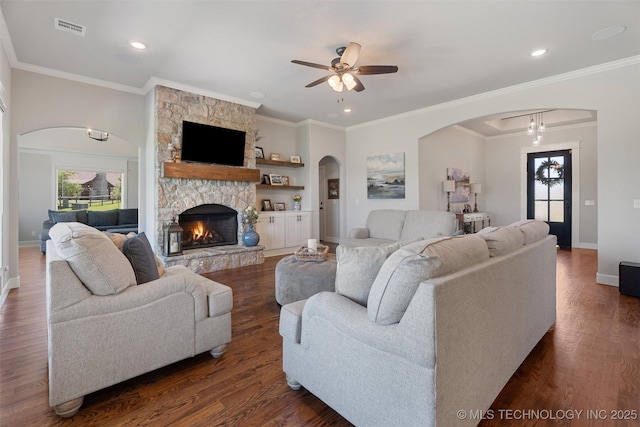 8209 N 150th Ave E, Owasso, OK 74055 - living area with arched walkways, a ceiling fan, dark wood finished floors, baseboards, and recessed lighting