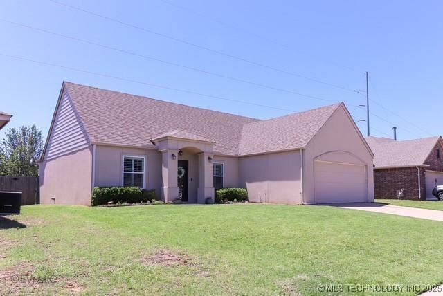 14538 S Kendalwood Blvd E, Glenpool, OK 74033 - single story home featuring stucco siding, driveway, a garage, a front yard, and a shingled roof