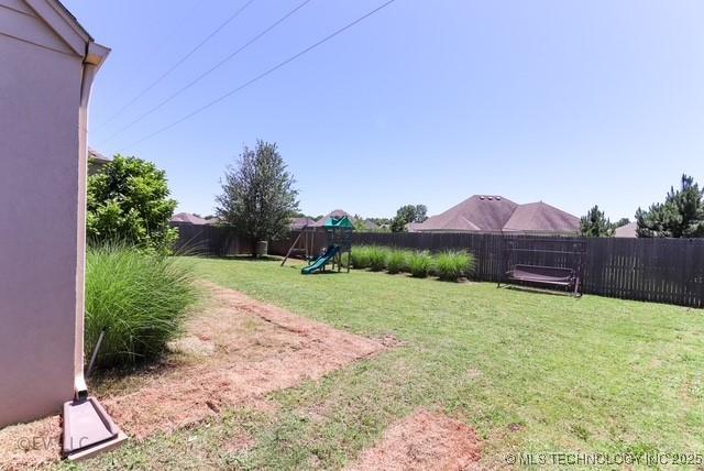 14538 S Kendalwood Blvd E, Glenpool, OK 74033 - view of yard with a playground