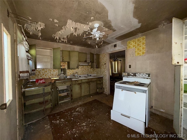 710 F St NW, Ardmore, OK 73401 - kitchen with electric range, ceiling fan, and concrete floors