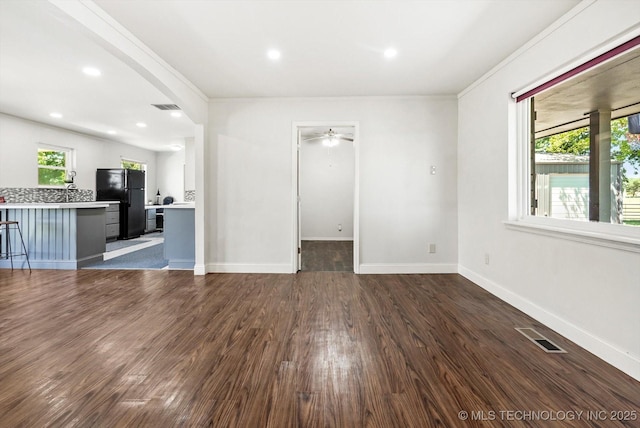 18094 S 461st E Ave, Porter, OK 74454 - unfurnished living room featuring dark wood-style flooring, a ceiling fan, baseboards, recessed lighting, and crown molding